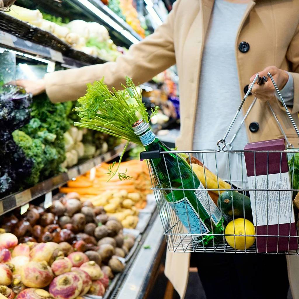 person with supermarket basket