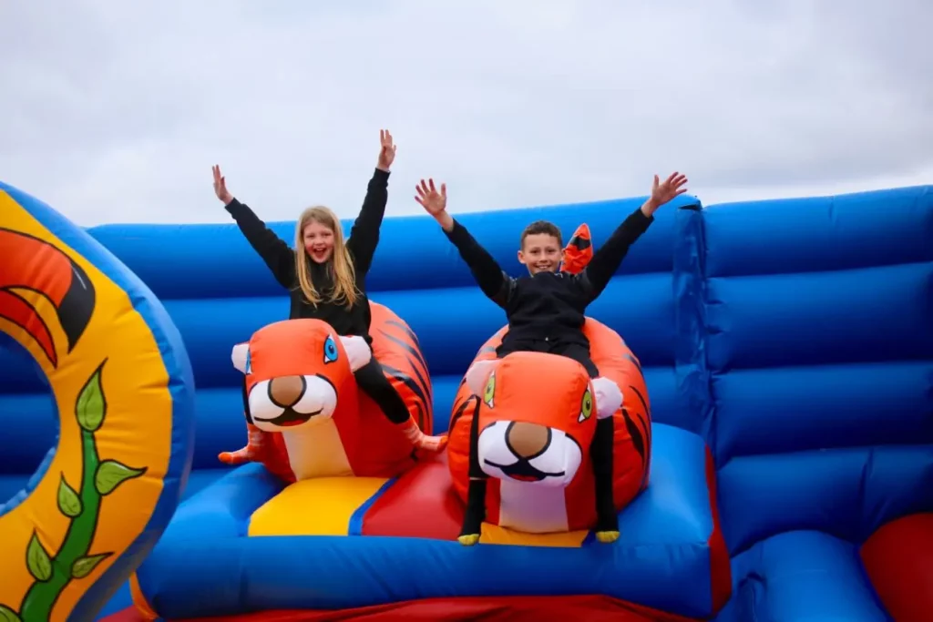 kids on tiger inflatables at open air bounce bolton