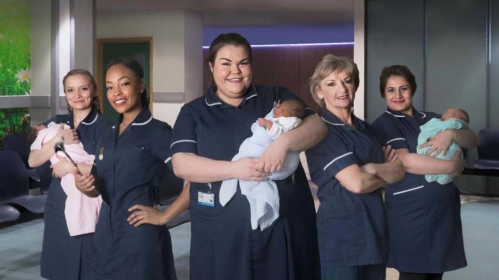 one born every minute image of midwives holding babies