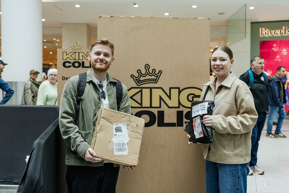 people stood with parcels at king colis pop-up in manchester arndale