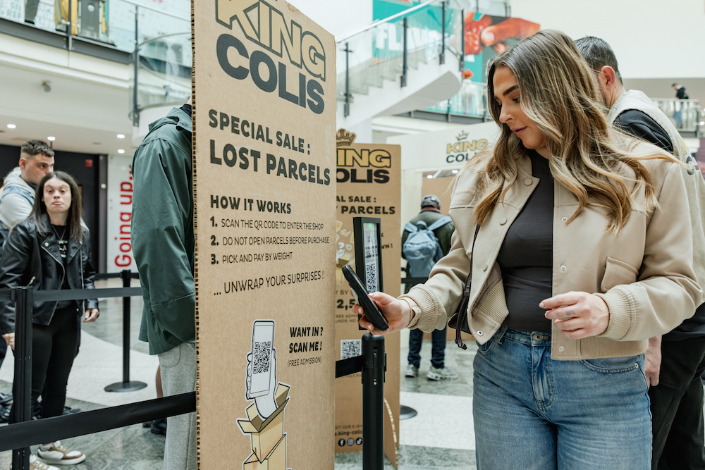 woman scanning qr code with mobile phone