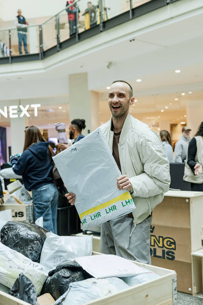 man happy with his mystery parcel at king colis manchester arndale