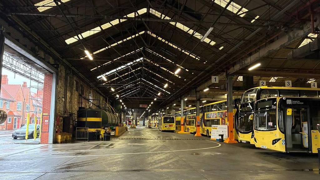 queens road garage with bee network buses