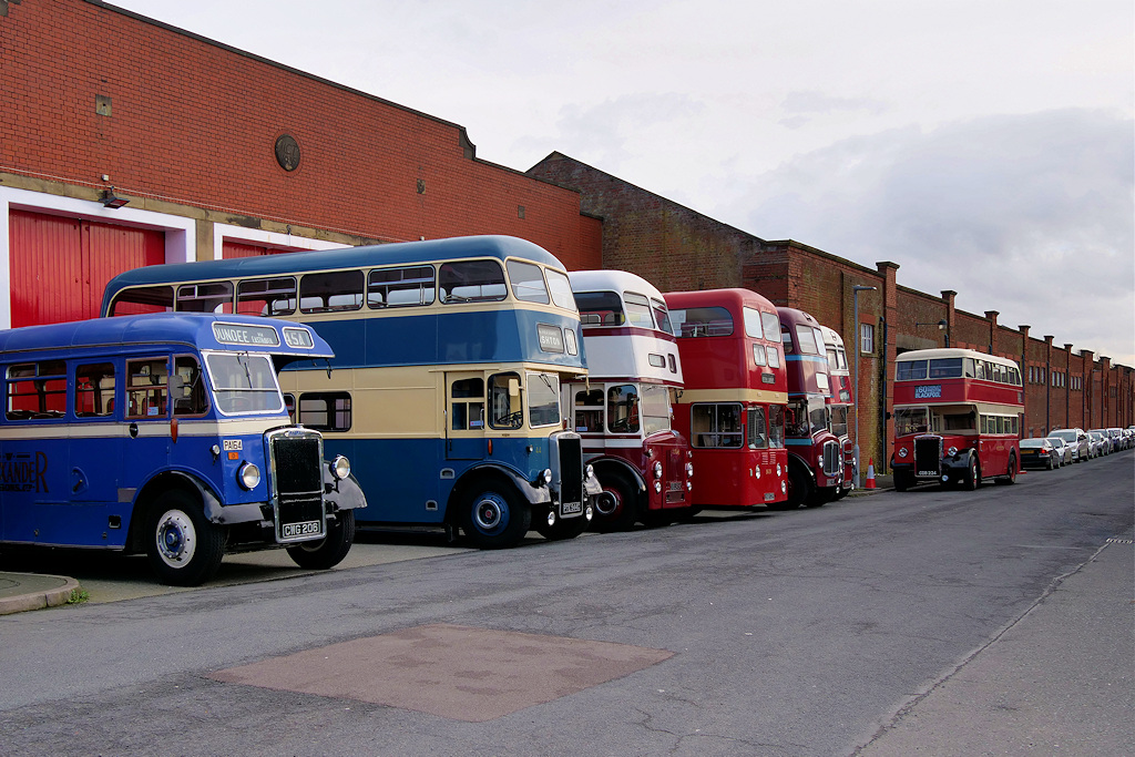 rows of vintage buses at museum of transport