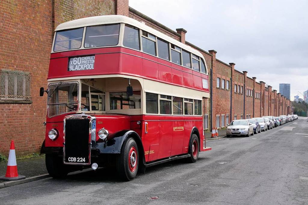 red vintage bus outside museum of transport