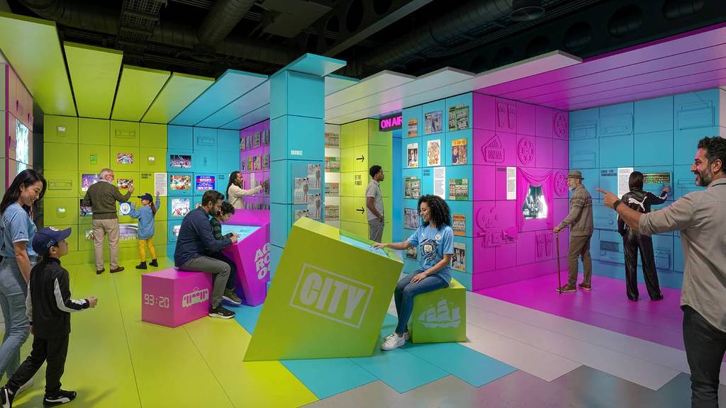 museum space with blue, green and pink walls and interactive activities
