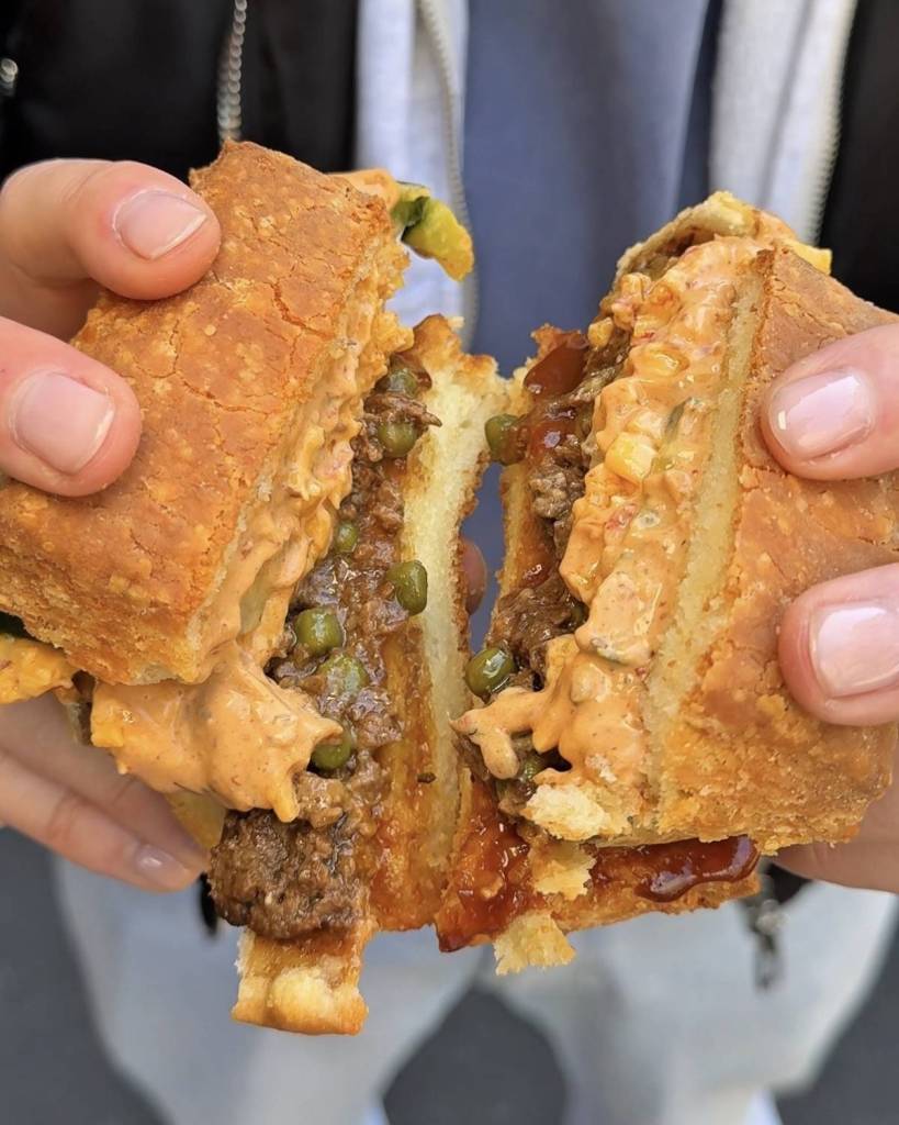 american biscuit with beef and bovril pie inside broken in half