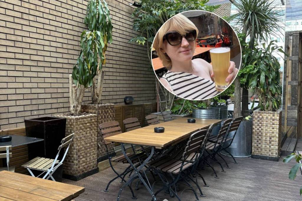 tangerine beer garden in salford with matti beatty holding pint of beer in hand in circle