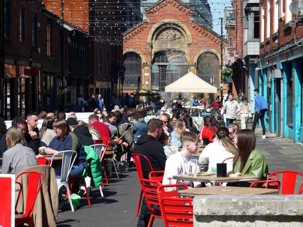 edge street northern quarter people sat outside