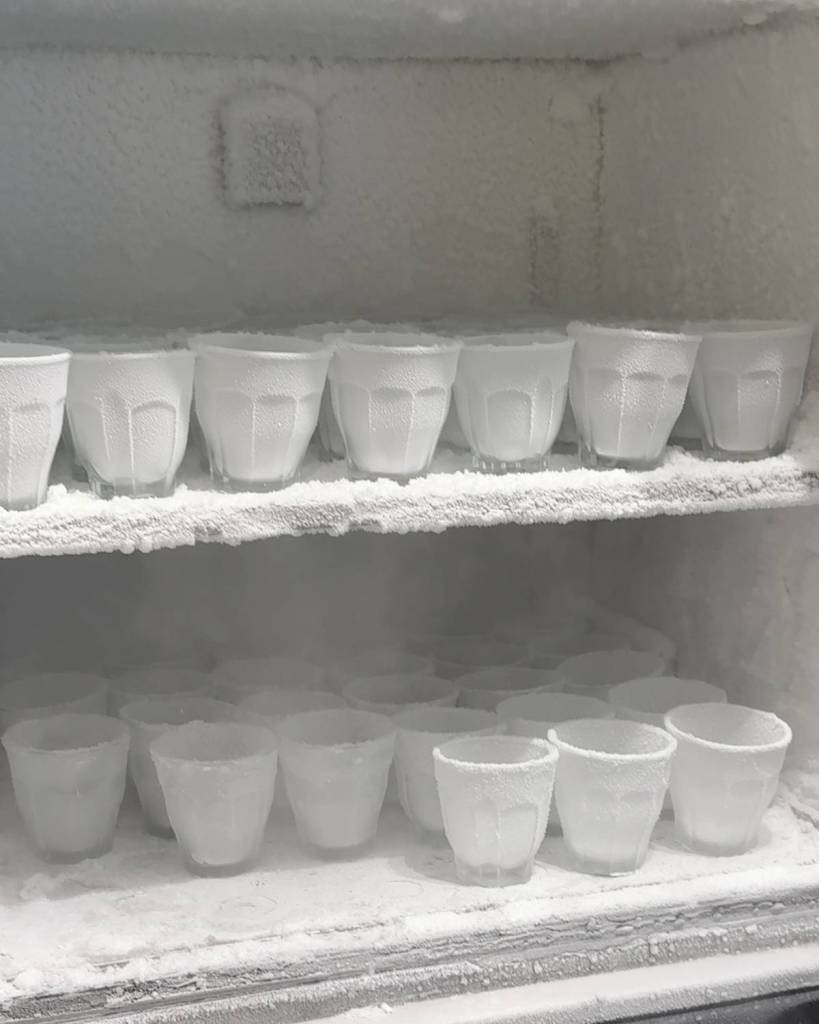 rows of frozen cups in freezer