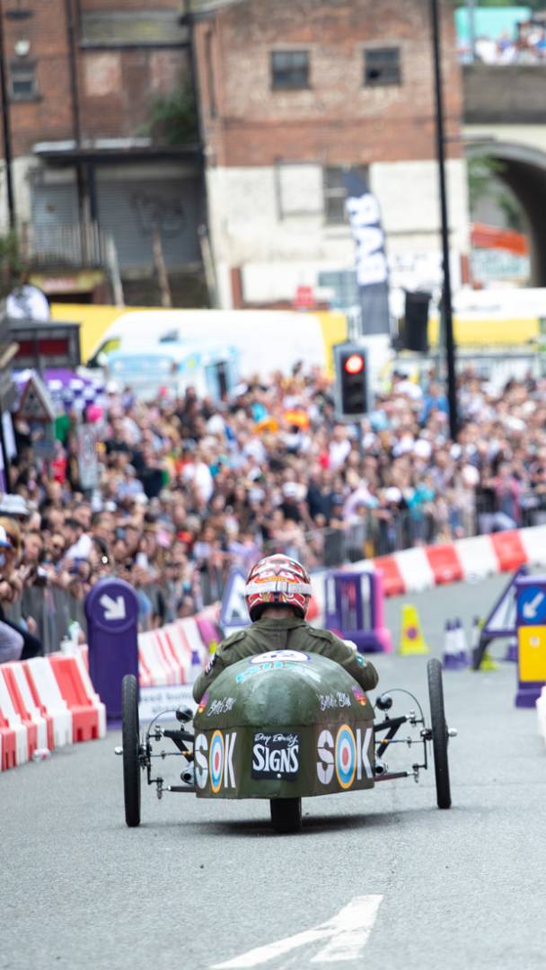 The UK’s largest touring soapbox derby is officially returning to Greater Manchester this summer with a 350m obstacle course, classic car display &amp; special RAF flypast