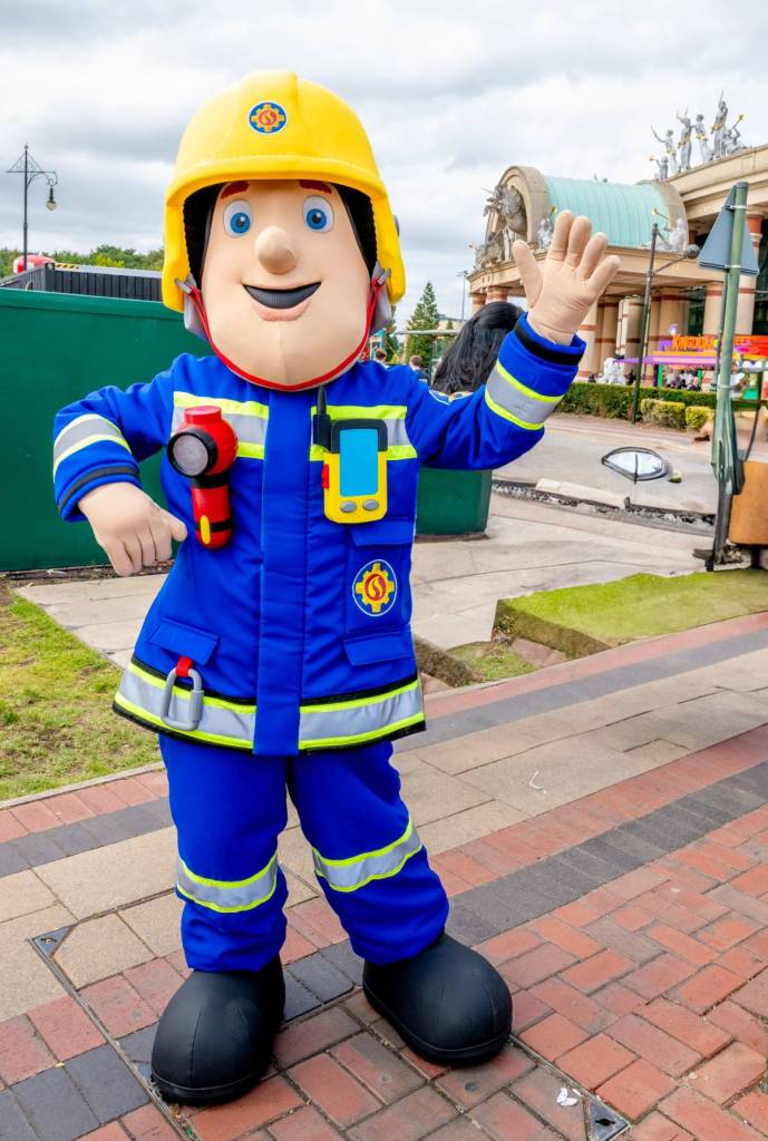 person in fireman sam mascot costume outside trafford centre