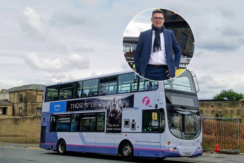 double decker First bus with andy burnham in circle
