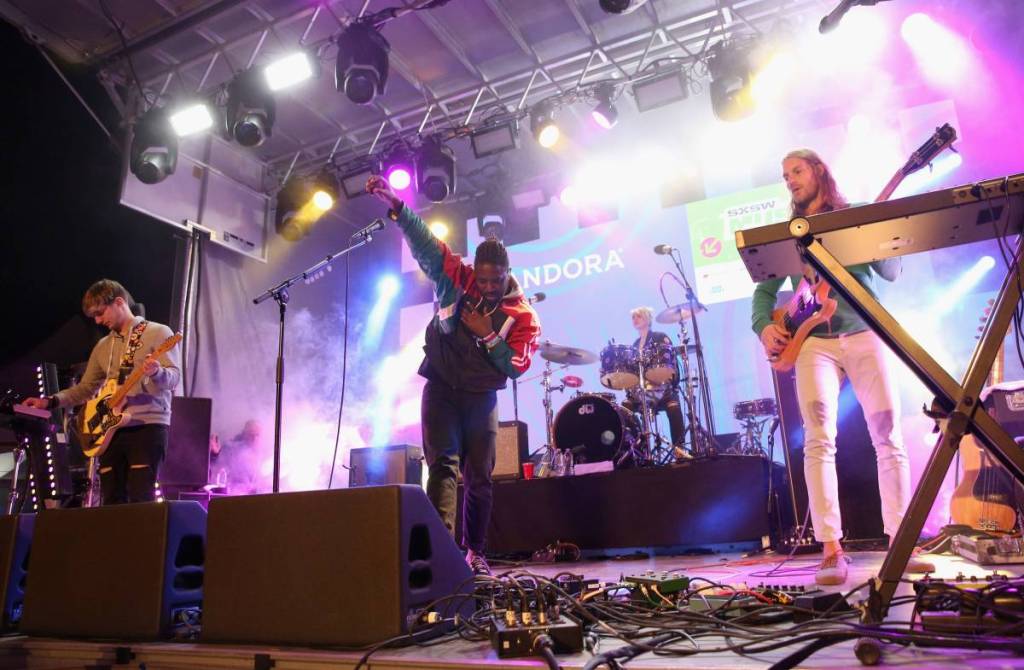 bloc party performing on stage coming to bury
