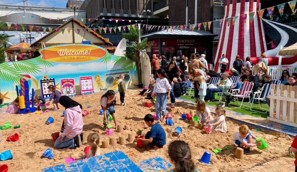 A giant free beach with golden sand, deckchairs and superhero takeovers has opened in this Greater Manchester town for the summer holidays