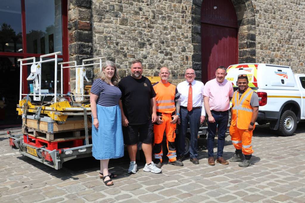 Network Rail's Clare Waller and ELR chair Mike Kelly with staff from both organisations