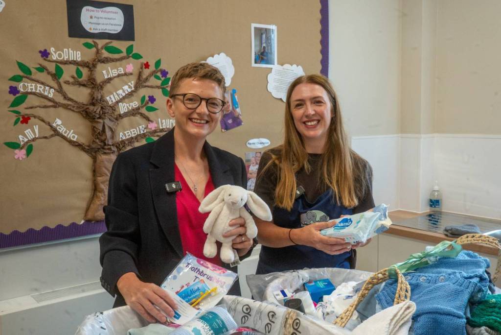Mayor Bev Craig and Alison Wakefield with one of the baby bundles at the Leigh Family Hub