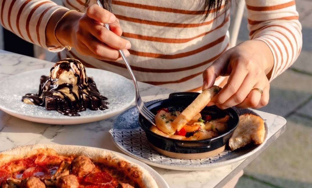prawn dish and brownie with vanilla ice cream at bella italia restaurant