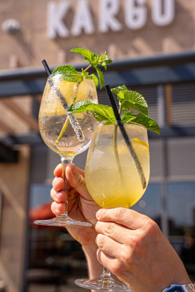 lychee cocktail held up outside kargo mkt salford