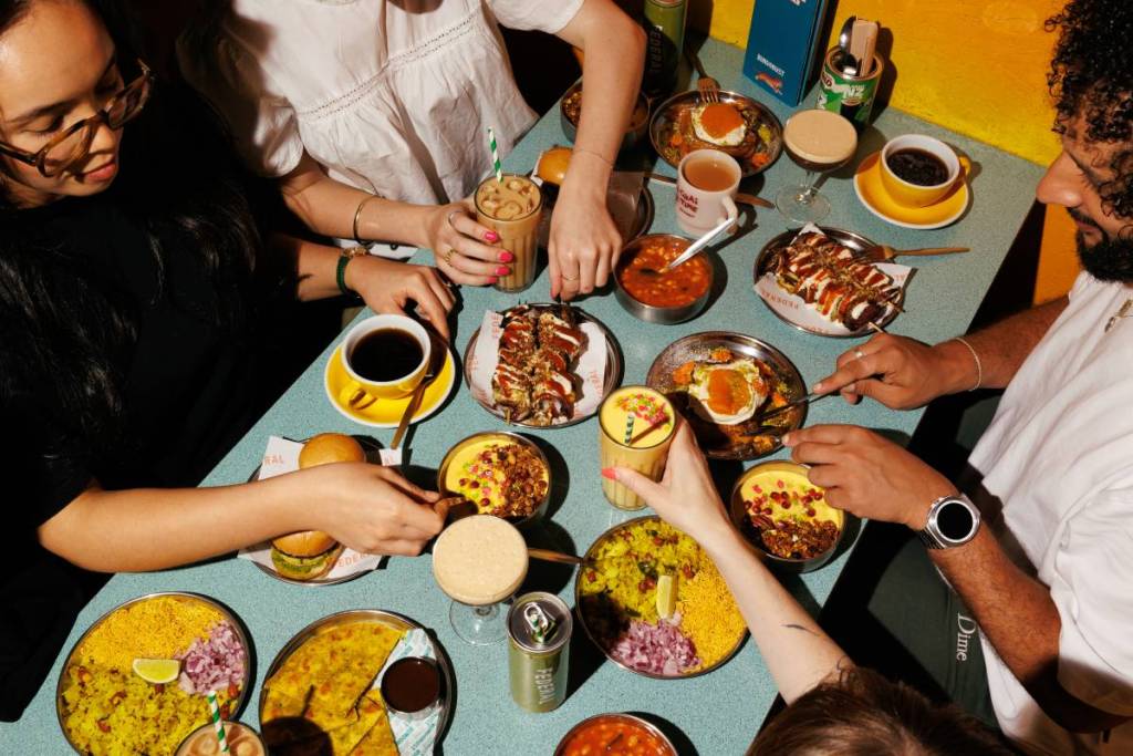 selection of bundobust x federal brunch dishes on blue table