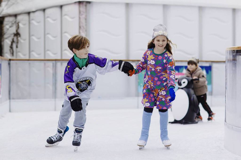 two children skating on the ice