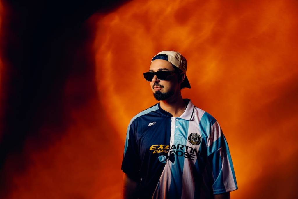 sonny fodera DJ in front of orange background