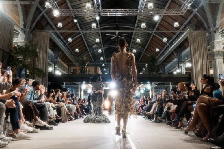 woman walking down catwalk at manchester fashion week