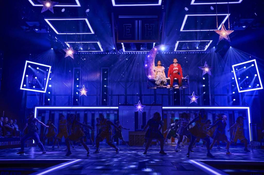 troy and gabriella in high school musical show sat a top of a moving moon stage piece