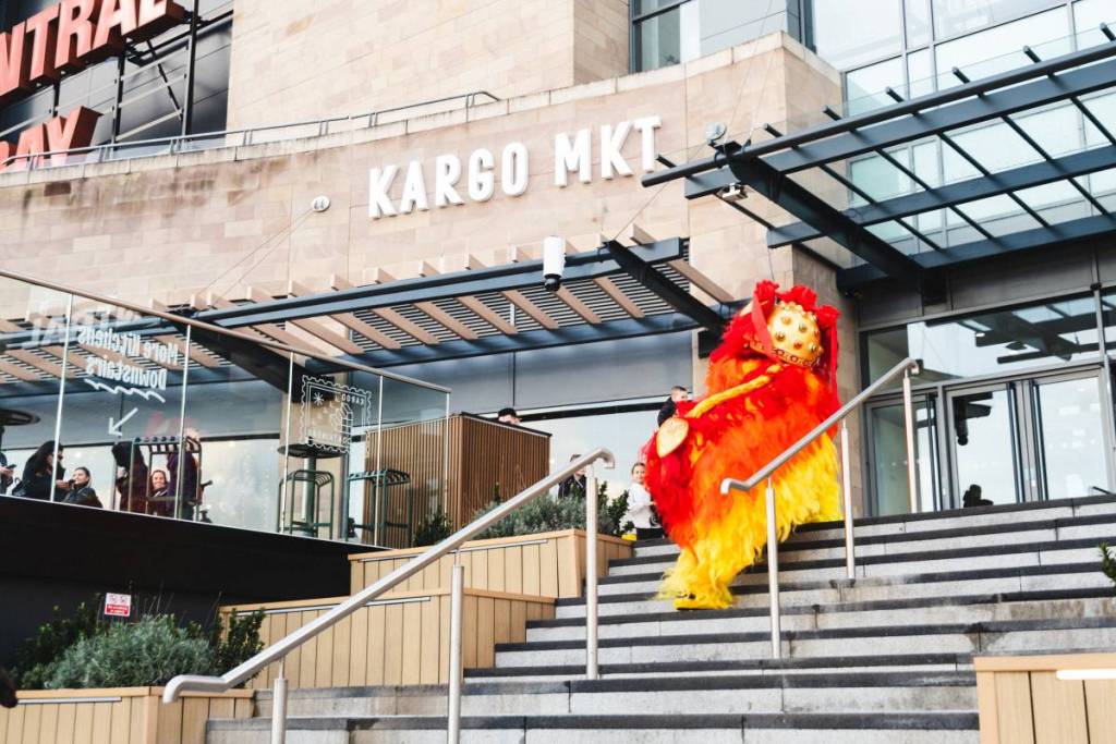 dragon on steps outside kargo mkt, quayside, salford