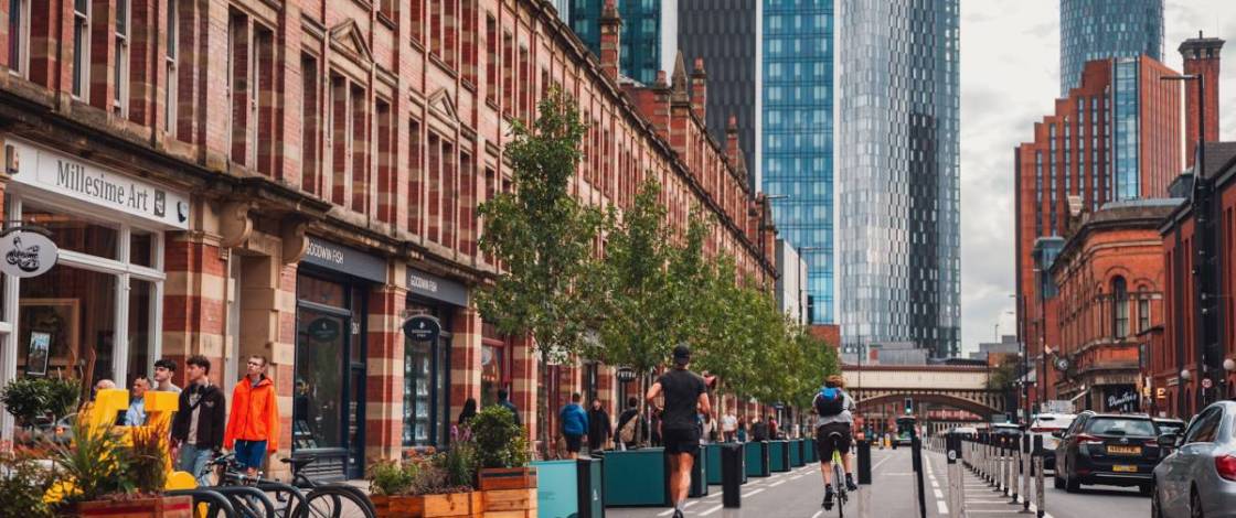 “The city is on a mission”: A 90m stretch of Manchester’s Deansgate has been transformed with 12 sweet gum trees and beehive planters made from upcycled Velodrome track wood