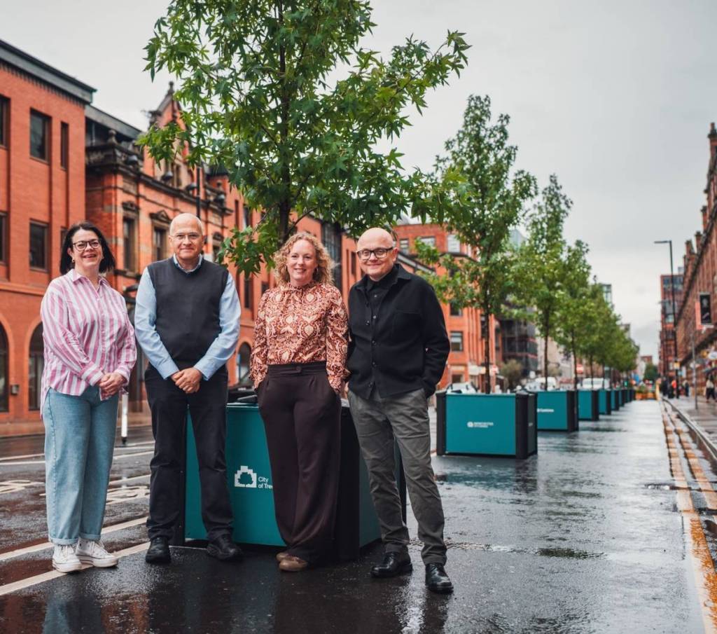 organisers stood next to tree planters on deansgate 