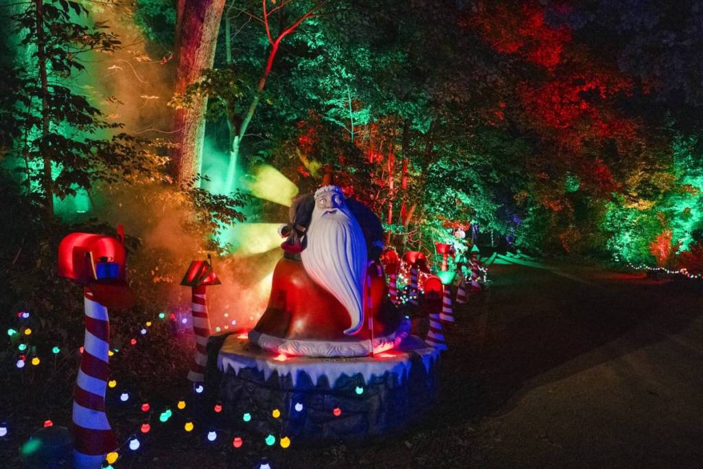 a light installation of Santa Claus surrounded by colourful Christmassy fairy lights and a striped candy cane, from Disney Tim Burton's The Nightmare Before Christmas