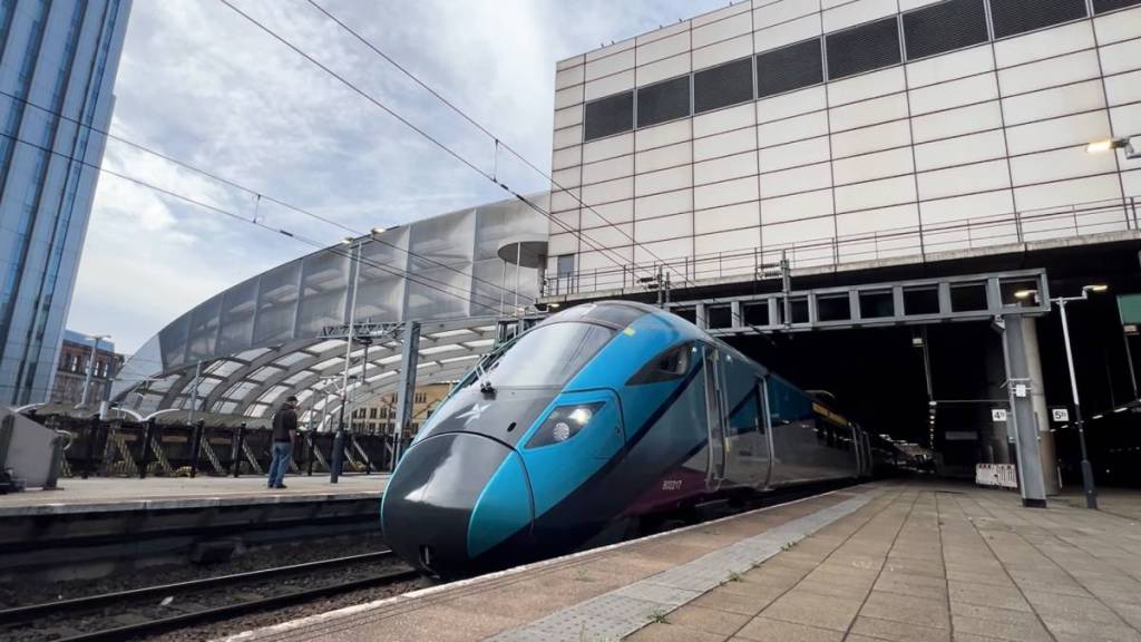 Transpennine Express train leaving Manchester Victoria