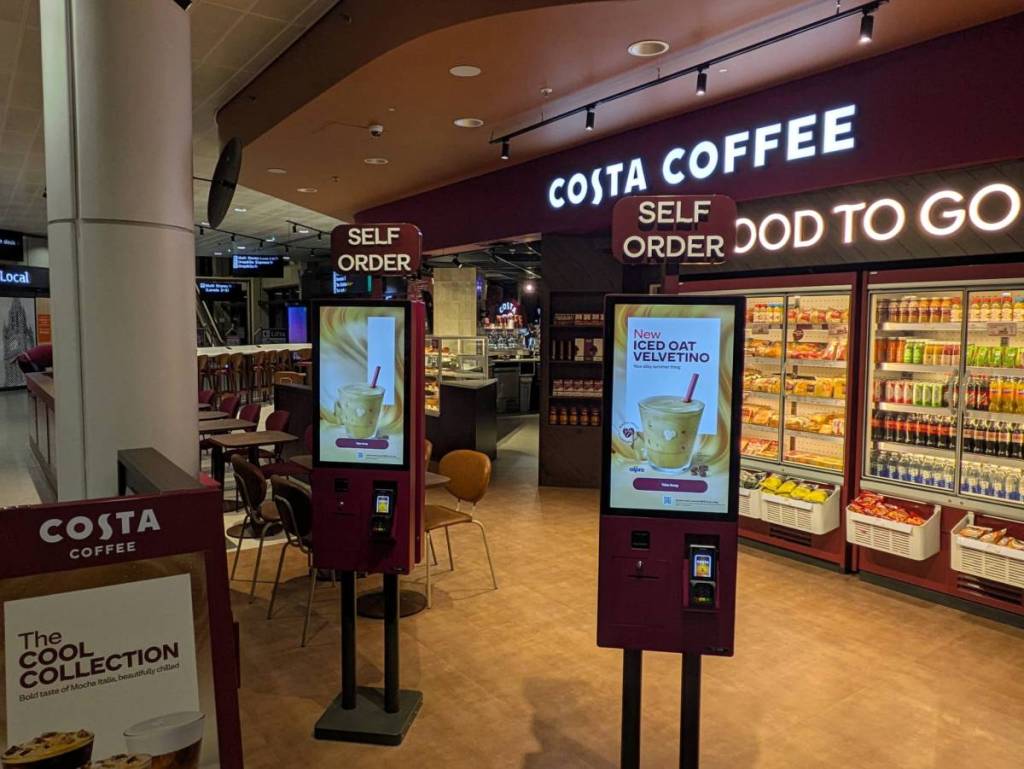 kiosk touchscreens at costa coffee manchester airport terminal 3 arrivals
