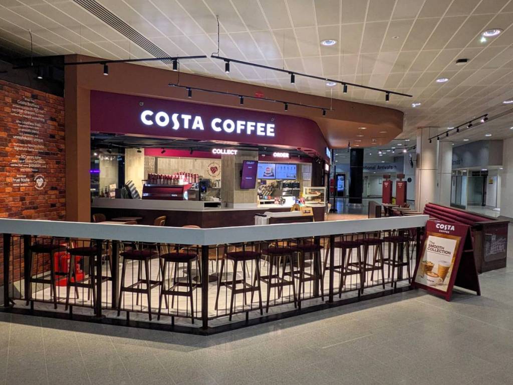 outside costa coffee store at manchester airport terminal 3 arrivals