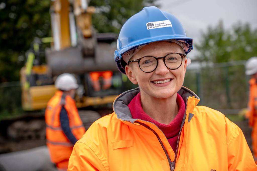 mayor bev craig with blue hard hat and high vis on at golborne station construction site