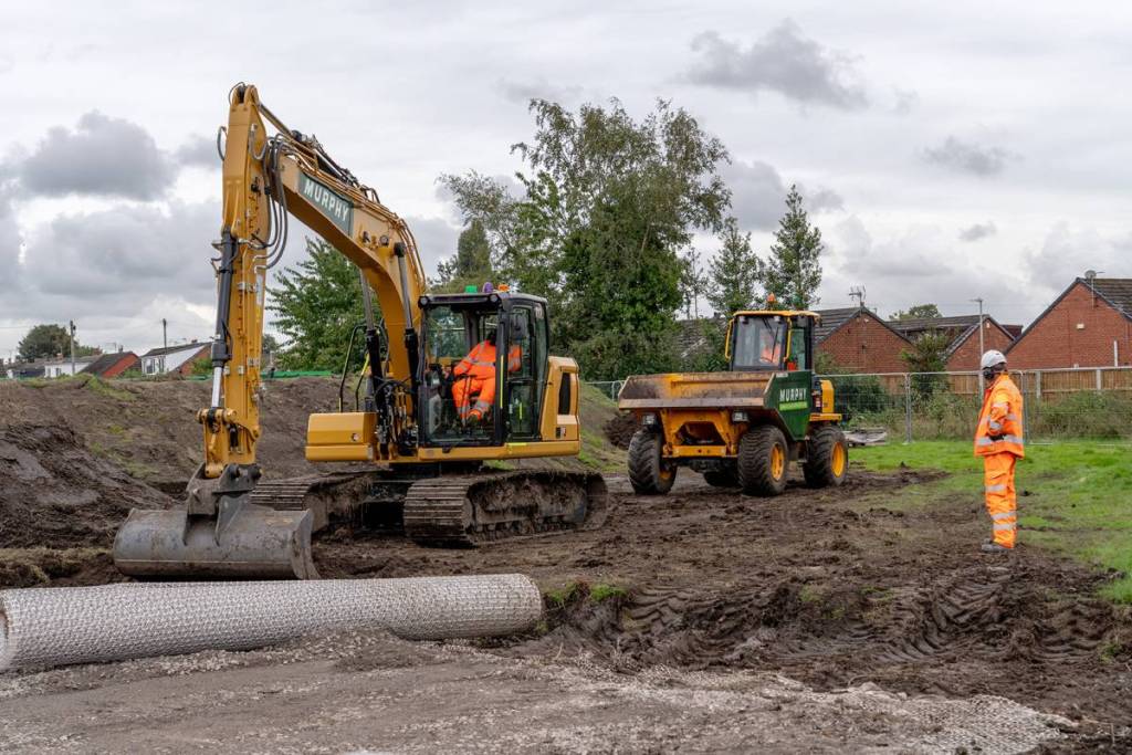 diggers at golborne station construction site