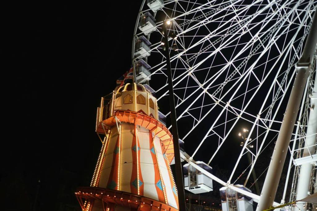 helter skelter and ferris wheel in albert square, manchester and part of christmas markets