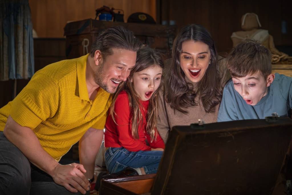 family fascinated by screen at IWM North