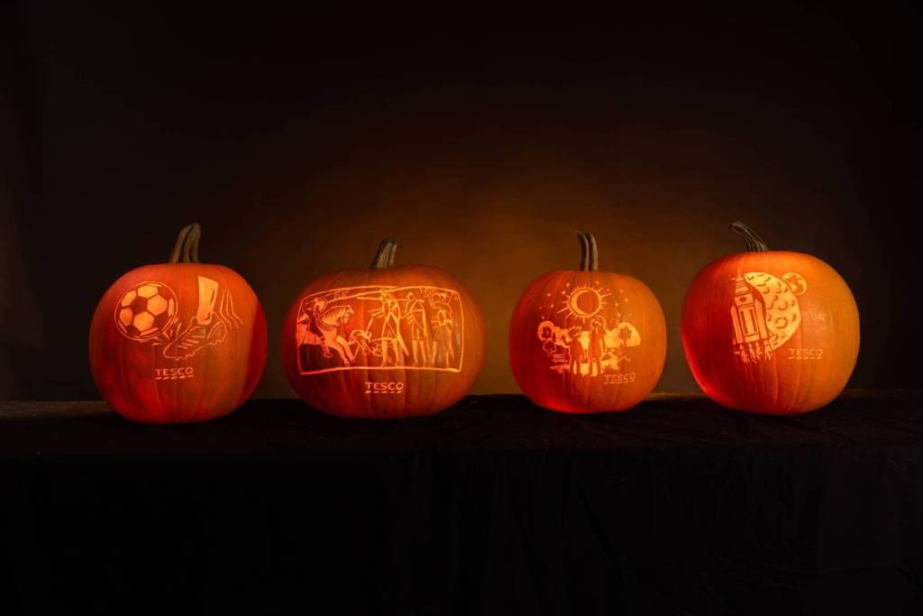 row of carved pumpkins