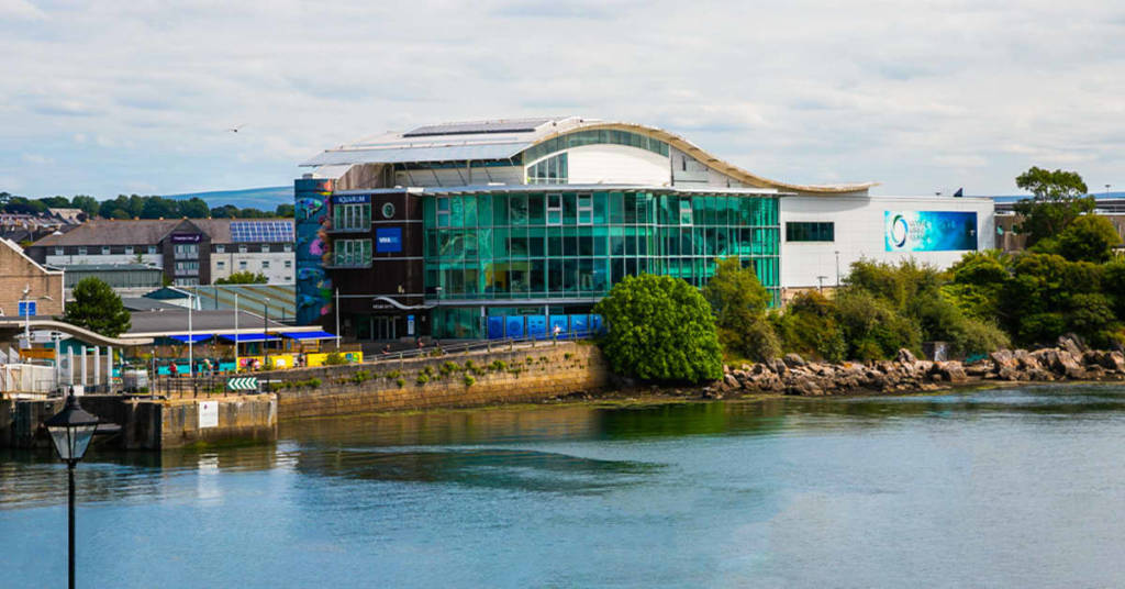 A wide shot of The National Marine Aquarium in Plymouth