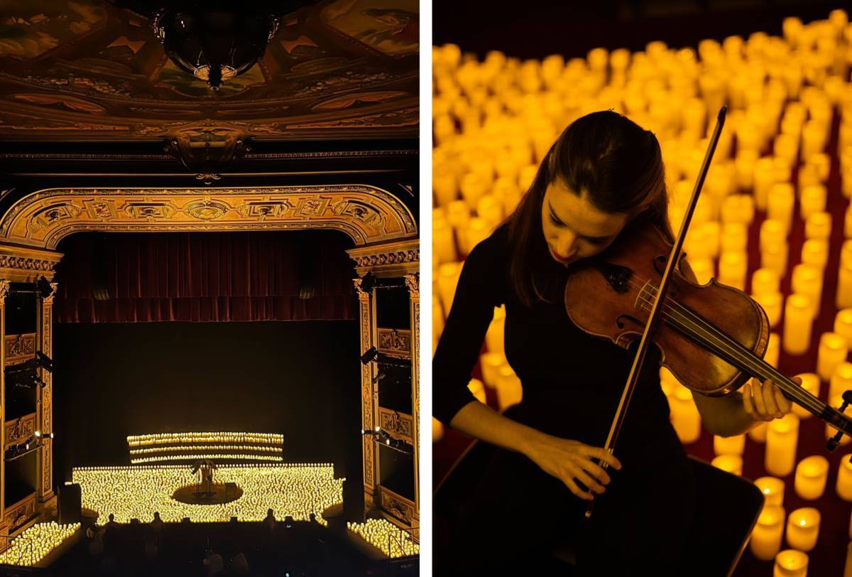 Vista del interior del Teatro Colón en Bogotá iluminado por miles de velas durante un concierto Candlelight. A la derecha, una violinista toca su instrumento bajo la luz de las velas.