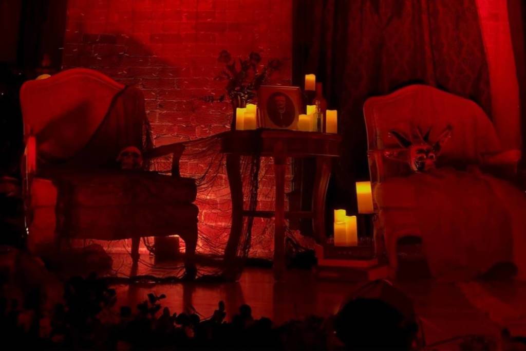 stage with ambient red lighting and candles
