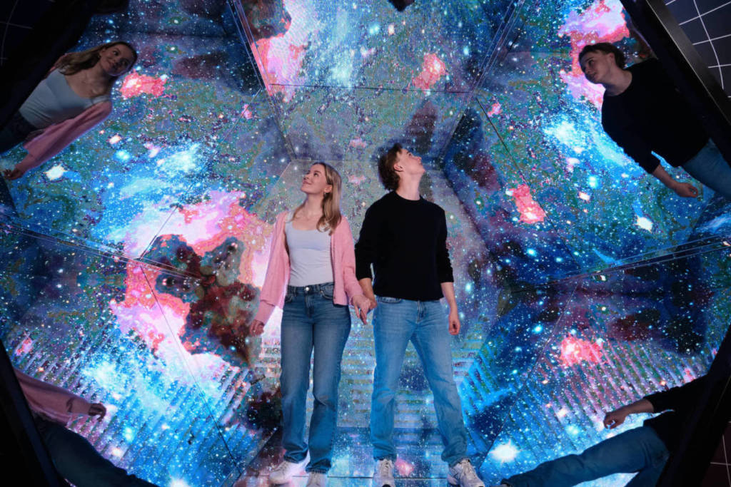 a couple look around in fascination at the Kaleidoscope illusion at the Paradox Museum