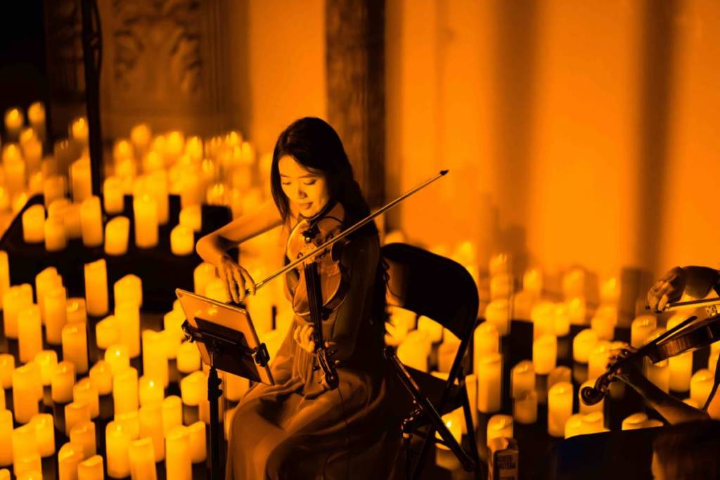 A violinist performs at a Candlelight concert