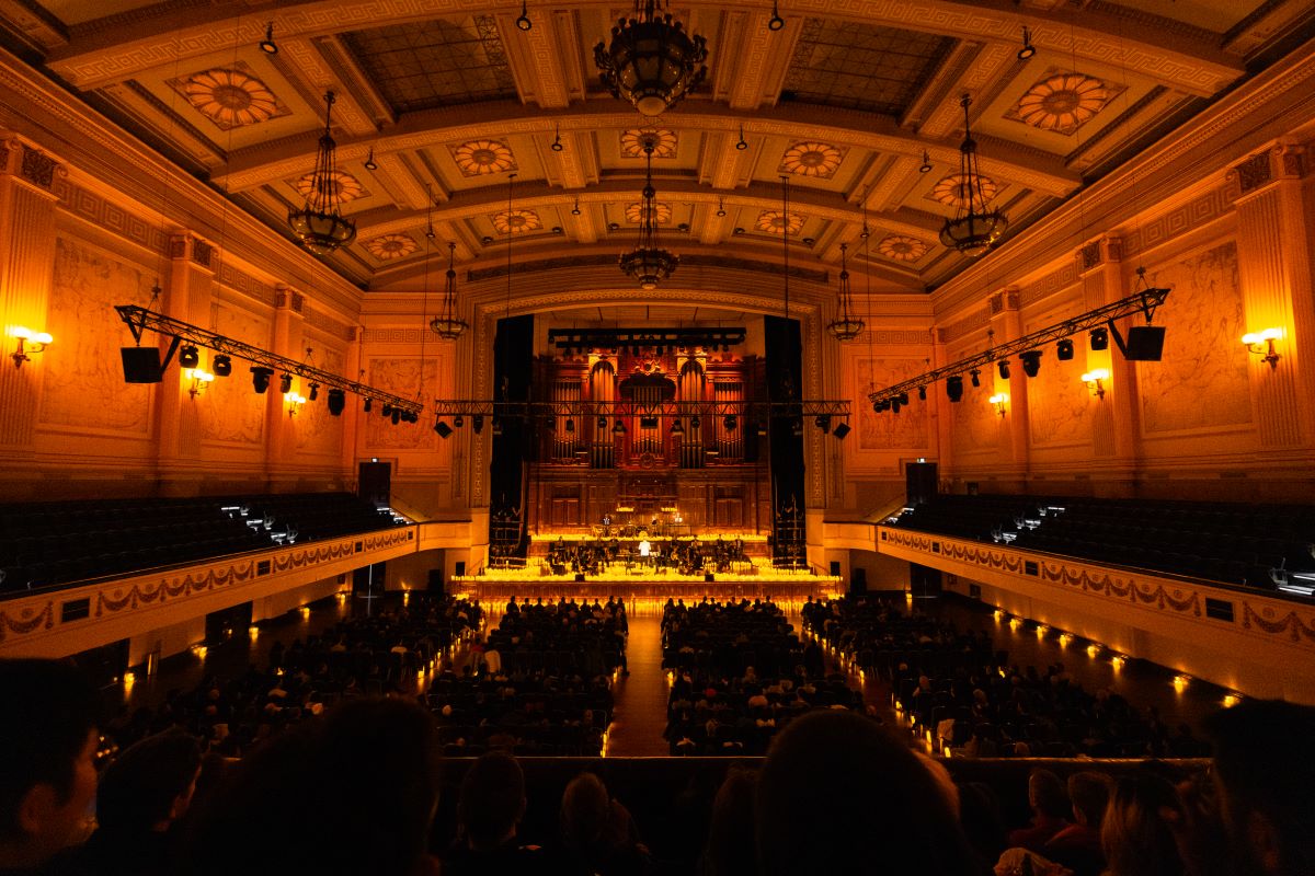 An orchestra performing a Candlelight concert at Town Hall, Melbourne.