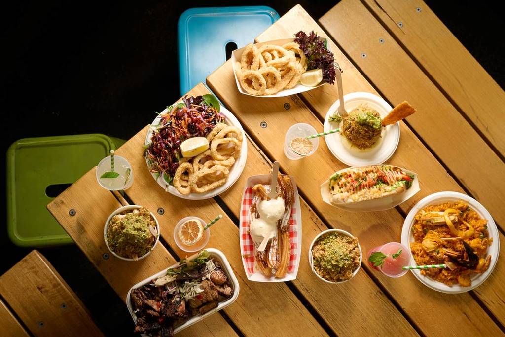 different plates of food and drinks that you can get at Summer Night Market