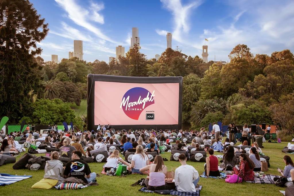 people looking at the Moonlight Cinema screen in the Royal Botanic Gardens