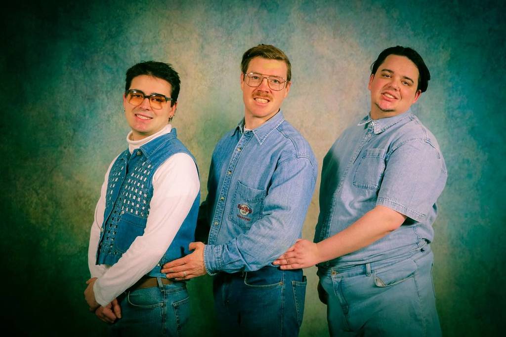 three men in double denim holding each other by the hips and doing grimaces instead of smiles for Awkward Portraits