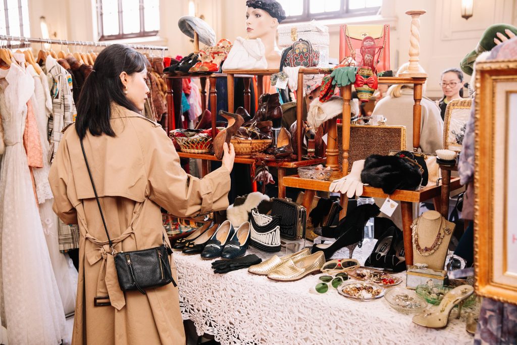 woman looking at accessories at Round She Goes